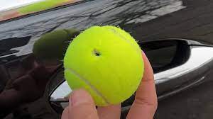 Car Gets Dented by a Tennis Ball